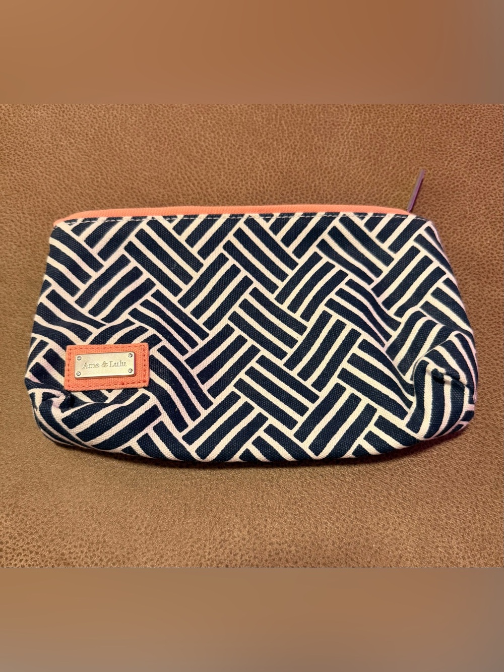 Ame & Lulu Stay Dry Swimsuit Bag in navy and white with coral accents